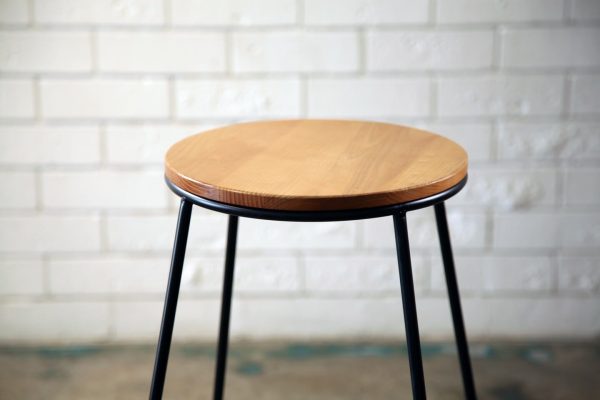 BLACK WOODEN TOP STOOL 2_resized Black-legged stool with a wooden seat, perfect for events, available from RSVP Event Hire in Perth.