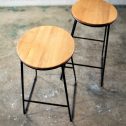 Black wooden top stool with a wooden seat and black legs, available from RSVP Event Hire in Perth.