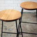 Black wooden top stool with a wooden seat and black legs, available from RSVP Event Hire in Perth.