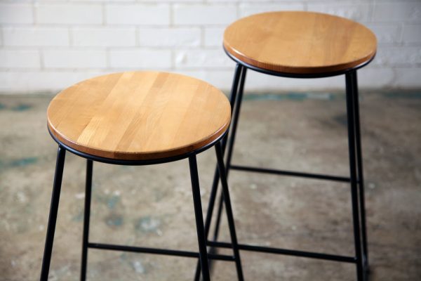 BLACK WOODEN TOP STOOL 4_resized Black wooden top stool with a wooden seat and black legs, available from RSVP Event Hire in Perth.