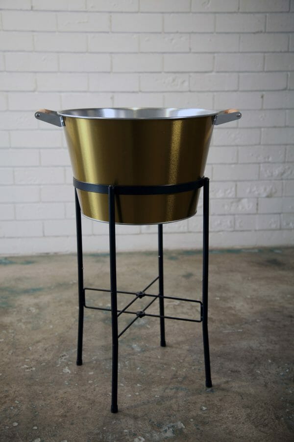 GOLD ICE BUCKETS - BLACK STAND 03_resized An elegant golden champagne bucket on a black stand, perfect for festive gatherings, event and party hire.