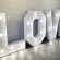 A glowing sign that says "LOVE" a charming addition for events, available for rental from RSVP Event Hire in Perth.