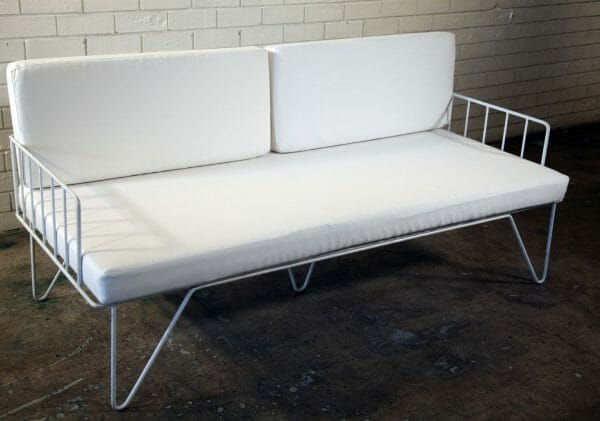 WHITE WIRE COUCH 02_resized Elegant white couch featuring metal legs and a white cushion, ideal for any event, offered for hire by RSVP Event Hire in Perth.