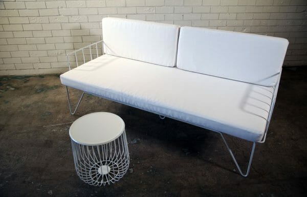 WHITE WIRE COUCH 05_resized Modern white couch with sleek metal legs and a white cushion, great for events, available for hire from RSVP Event Hire in Perth.