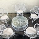 Elegant white wicker table and Peacock chairs with a round table, ideal for gatherings, offered by RSVP Event Hire in Perth.