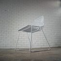 Chic white wire dining chair with a sturdy metal frame and comfortable white cushion, great for events or home use, available from RSVP Event Hire in Perth.