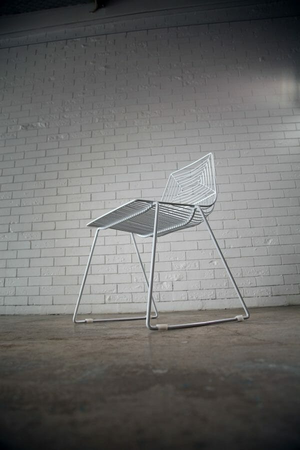 WHITE WIRE DINING CHAIR 03_resize Chic white wire dining chair with a sturdy metal frame and comfortable white cushion, great for events or home use, available from RSVP Event Hire in Perth.