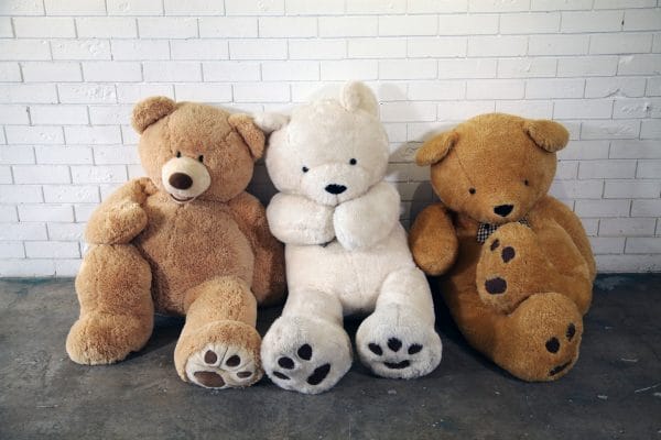 GIANT TEDDY BEARS Three giant teddy bears sitting on the floor, ready to bring joy to your event from RSVP Event Hire.
