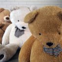 A charming scene of three giant teddy bears on the floor, perfect for events, available for hire from RSVP Event Hire.