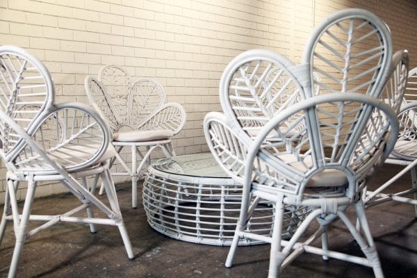 PEACOCK SETTING 02_resize 2. Elegant white wicker table and chairs, ideal for gatherings, offered by RSVP Event Hire in Perth.