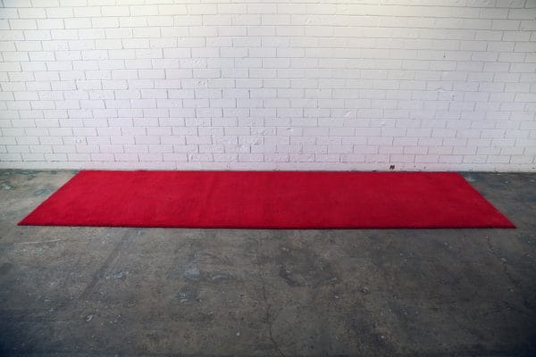 RED CARPET 03_resize A striking 3-metre red carpet in a room, ideal for events, offered for hire by RSVP Event Hire in Perth